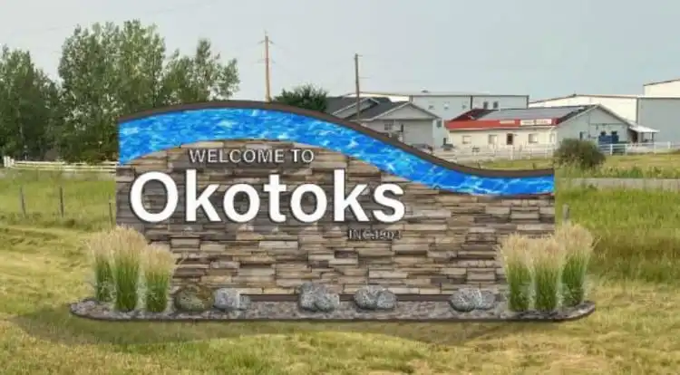 Welcome to Okotoks sign, Sheep River valley south of Calgary